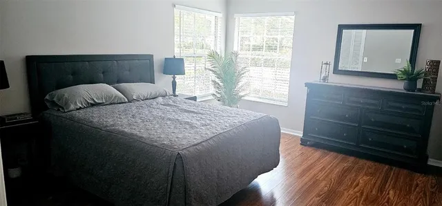 a bedroom with a bed and a dresser