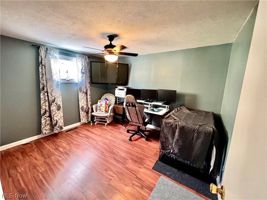 2852 Shelly Road Ravenna, OH 44266 - Photo 20 of 30 Office with wood finished floors, a textured ceiling, and ceiling fan