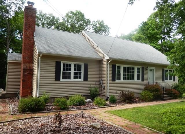 39 Aspen Ledges Road Ridgefield, CT 06877 - Photo 1 of 1 a front view of a house with garden