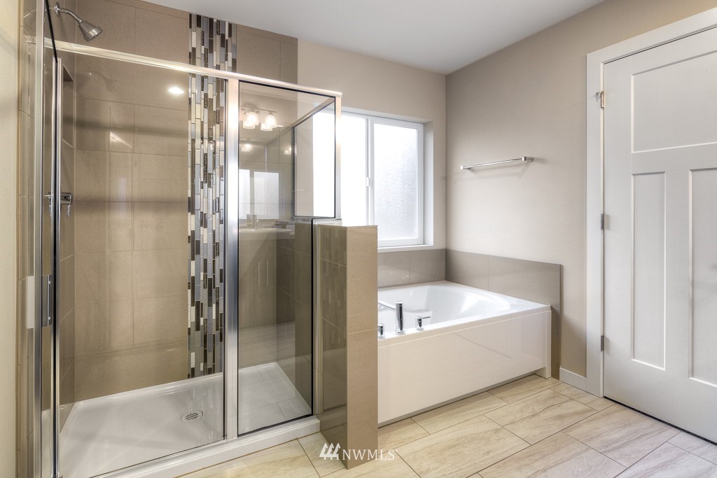 2125 228th Place Southwest, Unit EP12 Bothell, WA 98021 - Photo 14 of 16 a bathroom with a tub a shower and a sink
