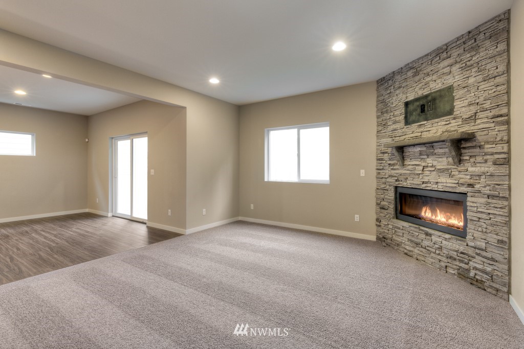 2125 228th Place Southwest, Unit EP12 Bothell, WA 98021 - Photo 7 of 16 a view of empty room with a fireplace