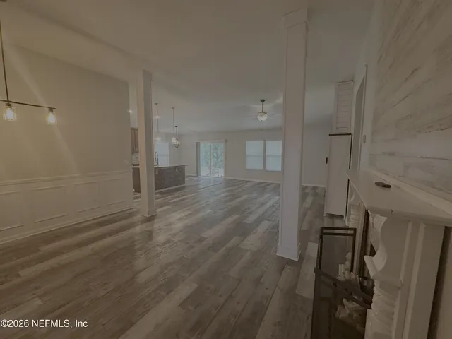 a view of a kitchen with a sink dishwasher a refrigerator and cabinets