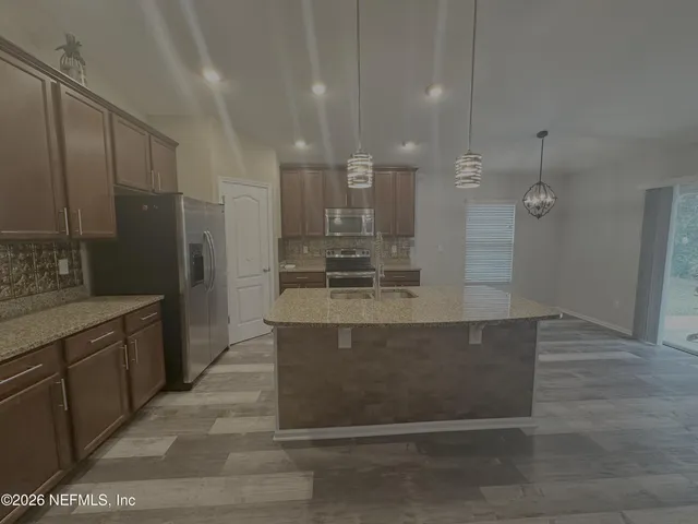 a living room with furniture and fireplace