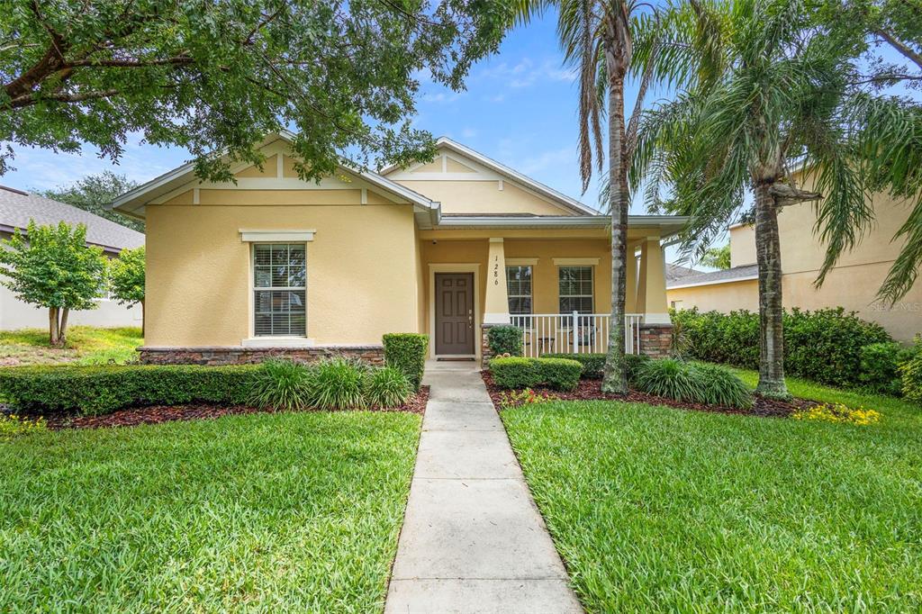 1286 Tallow Road Apopka, FL 32703 - Photo 1 of 1 a front view of a house with a yard
