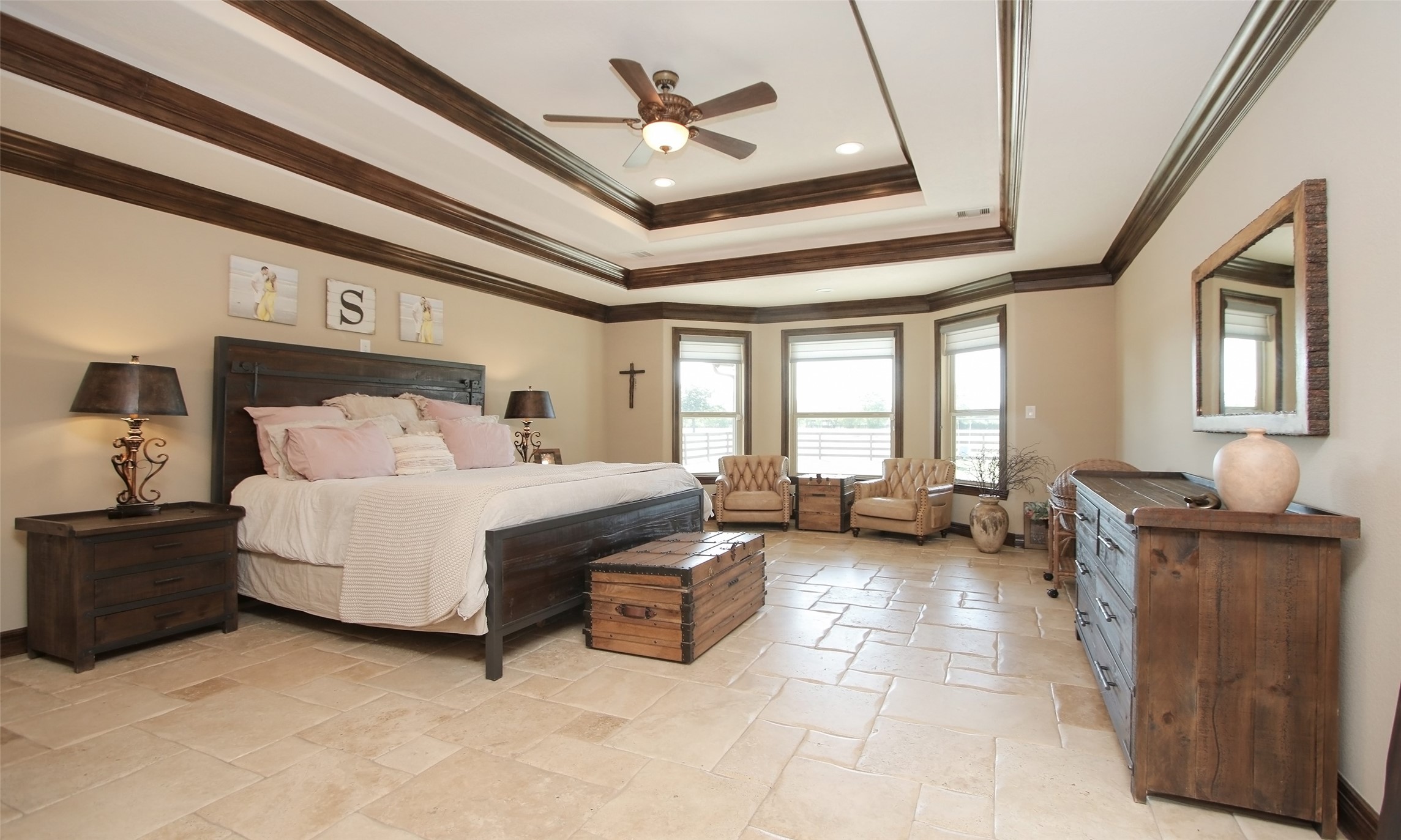 624 High Meadow Ranch Drive Magnolia, TX 77355 - Photo 20 of 42 a spacious bedroom with a bed and a chandelier