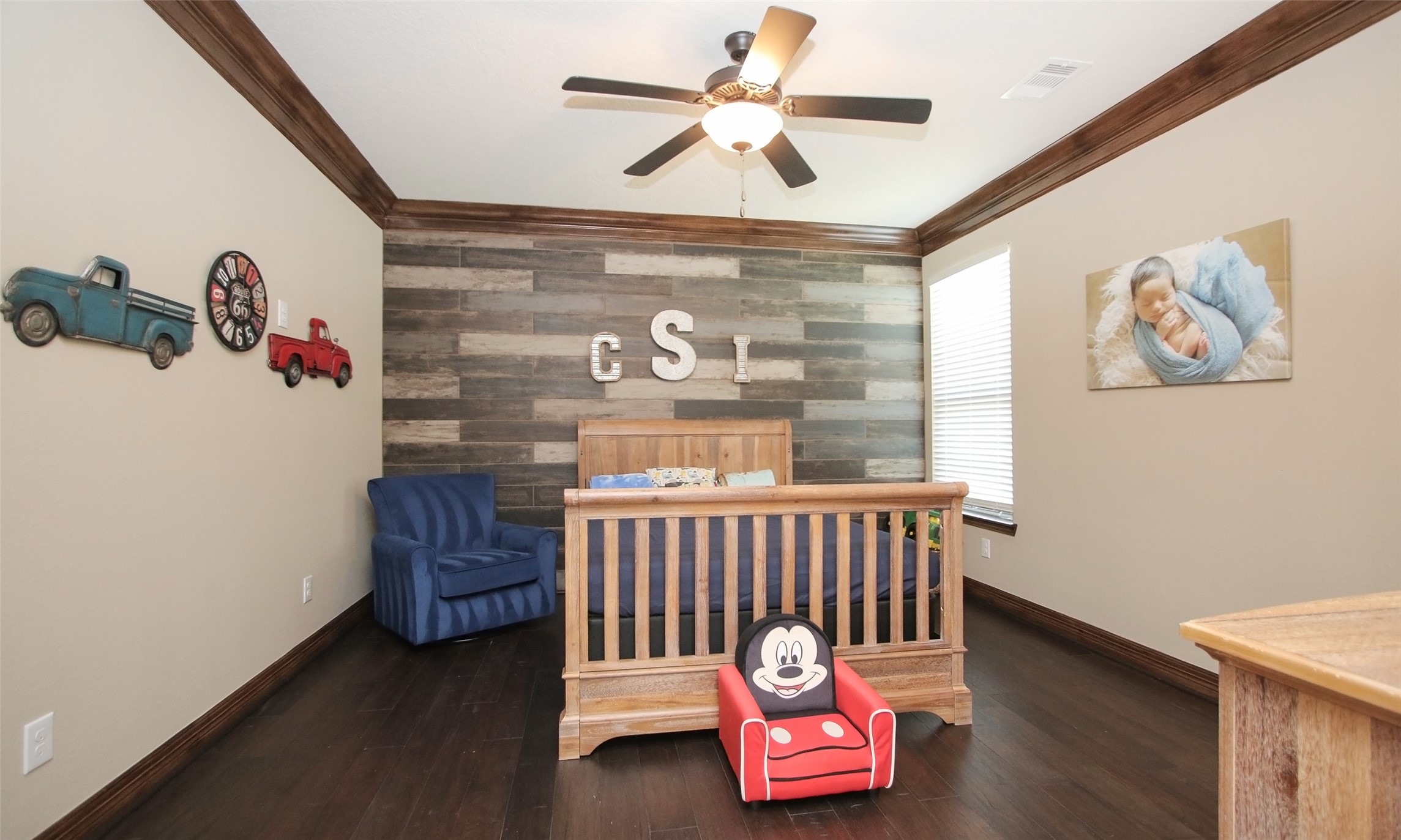 624 High Meadow Ranch Drive Magnolia, TX 77355 - Photo 25 of 42 a bedroom with a bed and a chandelier