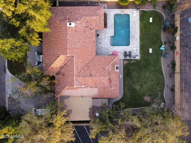 an aerial view of residential houses with outdoor space