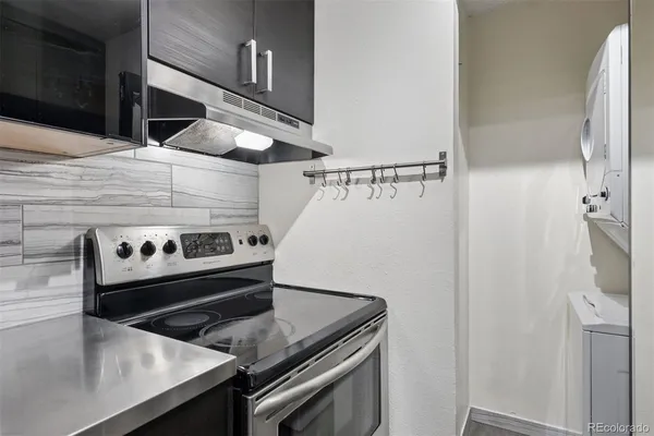 a stove top oven sitting inside of a kitchen