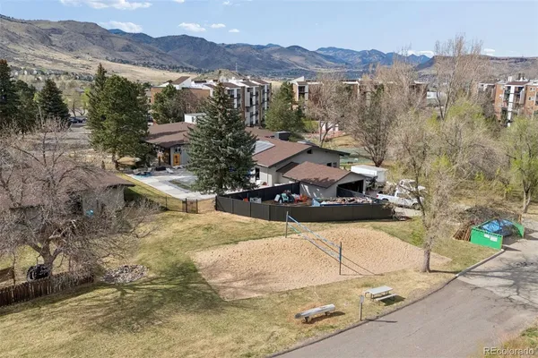 an aerial view of a house with a yard