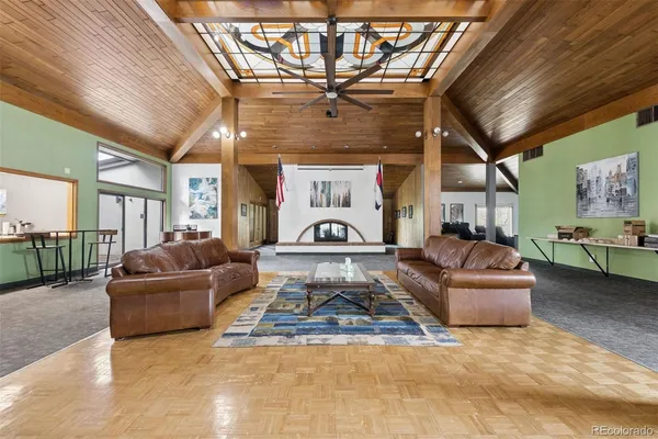 a living room with a couch and a chandelier