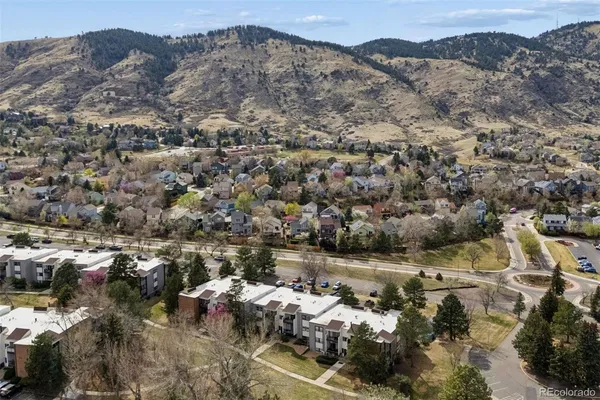 an aerial view of residential houses with outdoor space