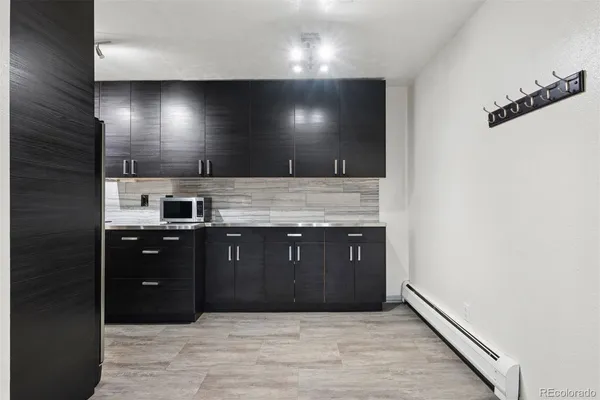 a kitchen with a sink and a refrigerator