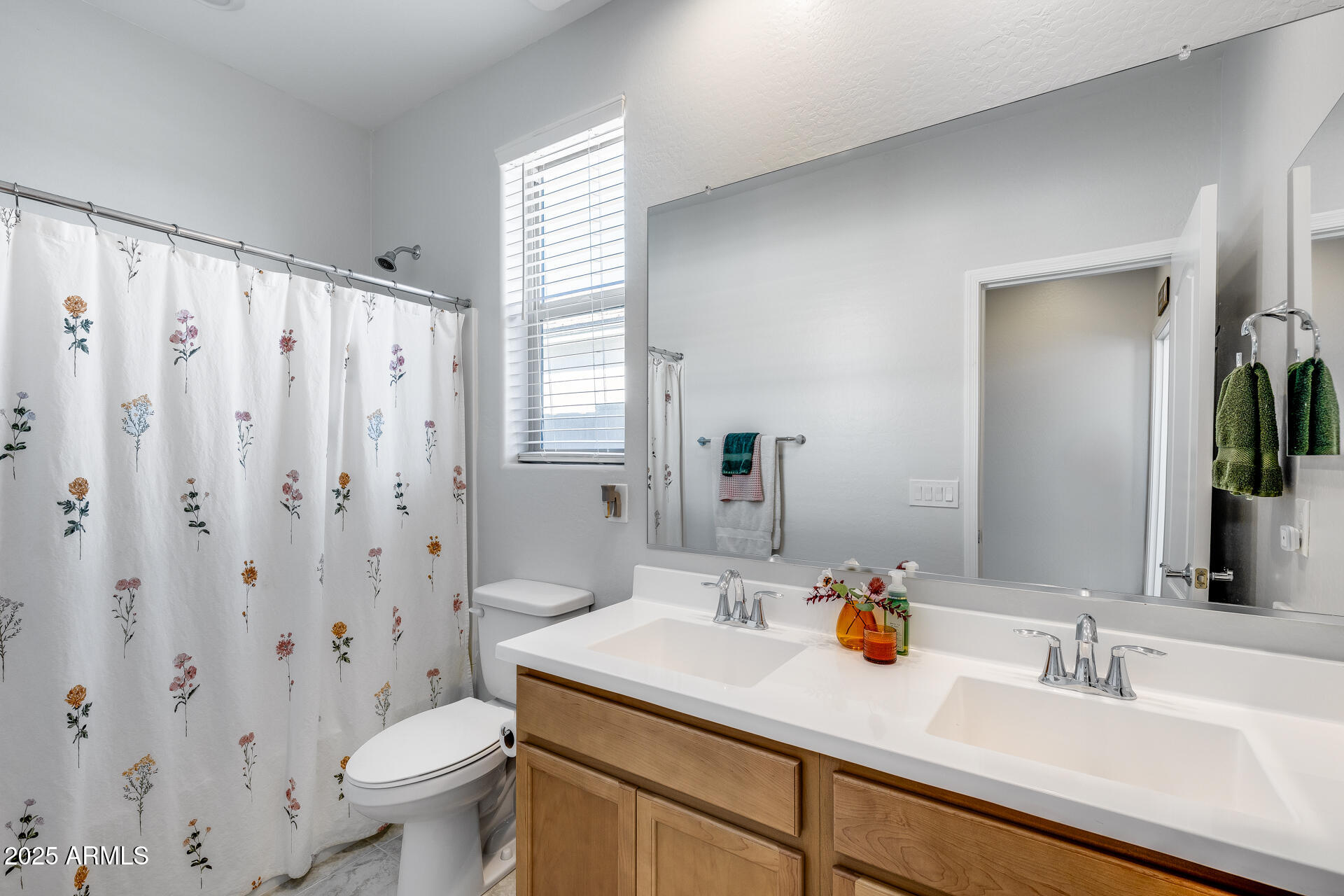 14866 West Sand Hills Road Surprise, AZ 85387 - Photo 11 of 54 a bathroom with a sink toilet and shower
