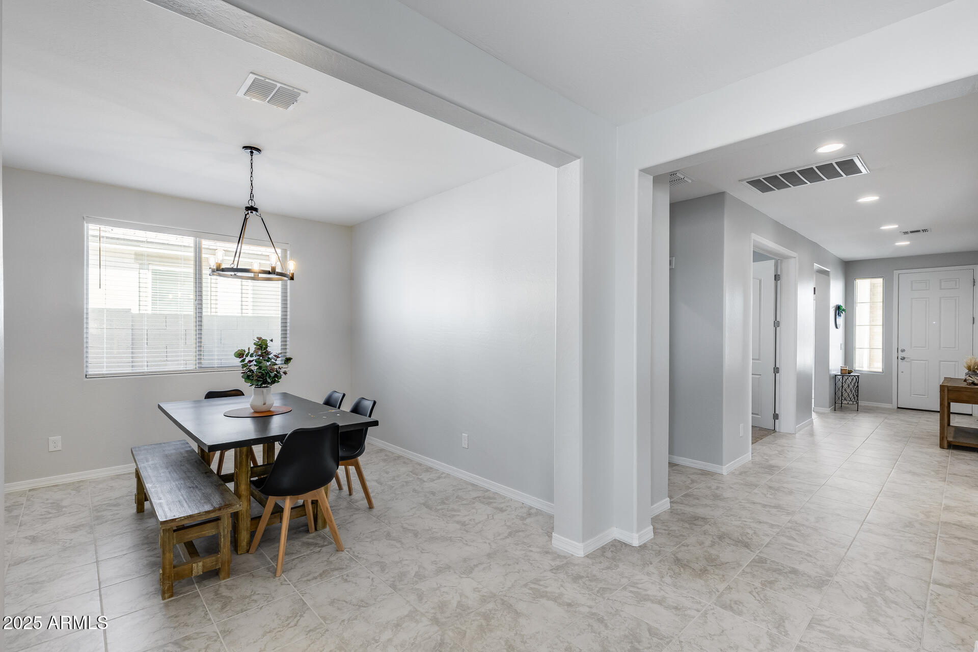 14866 West Sand Hills Road Surprise, AZ 85387 - Photo 18 of 54 a dining room with furniture and window