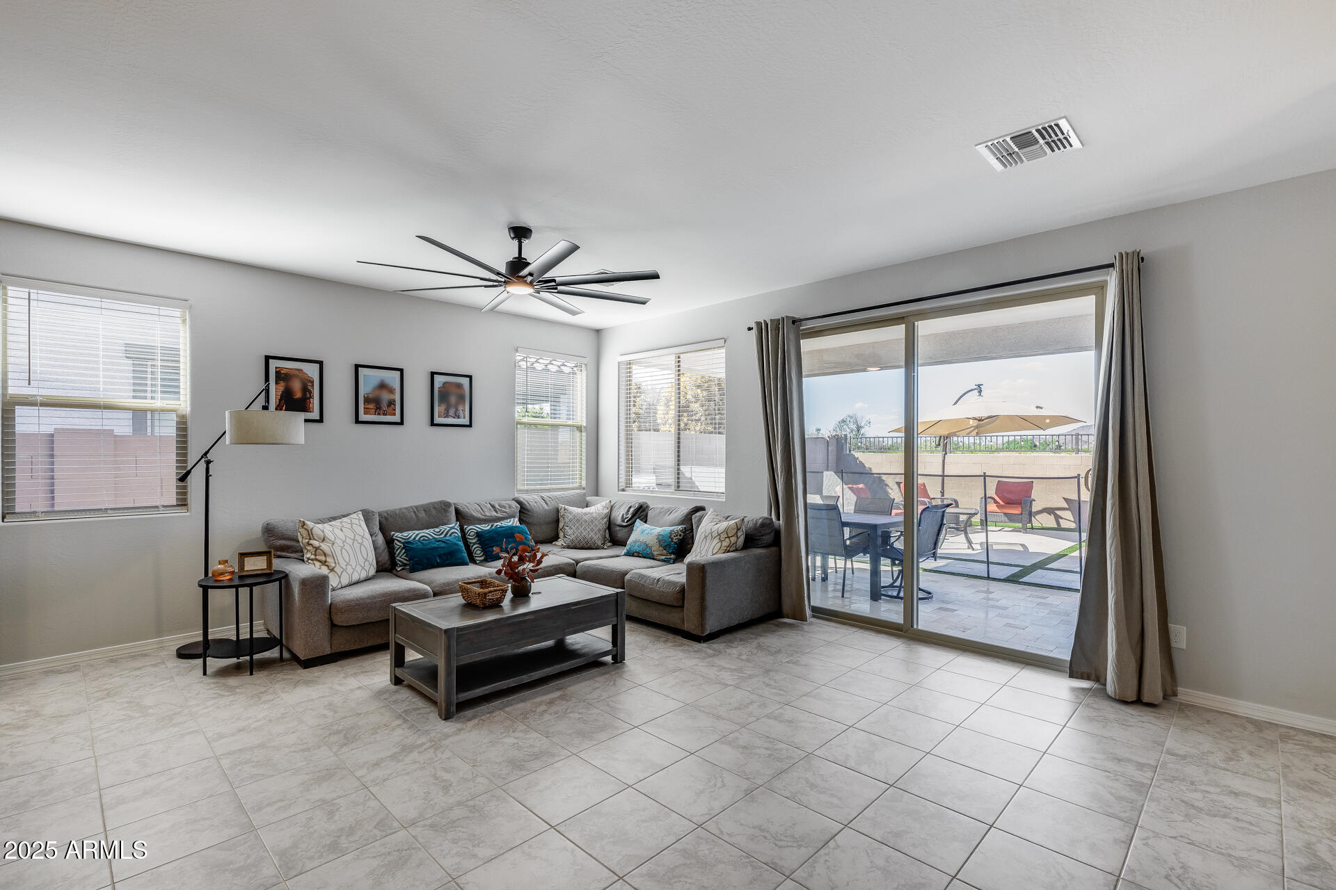 14866 West Sand Hills Road Surprise, AZ 85387 - Photo 24 of 54 a living room with furniture and a large window