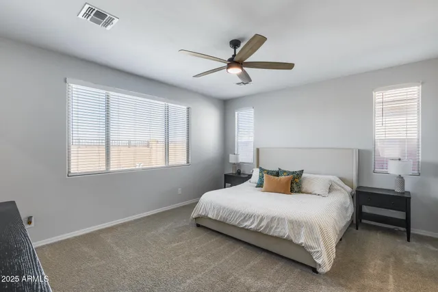 a bedroom with a bed and window