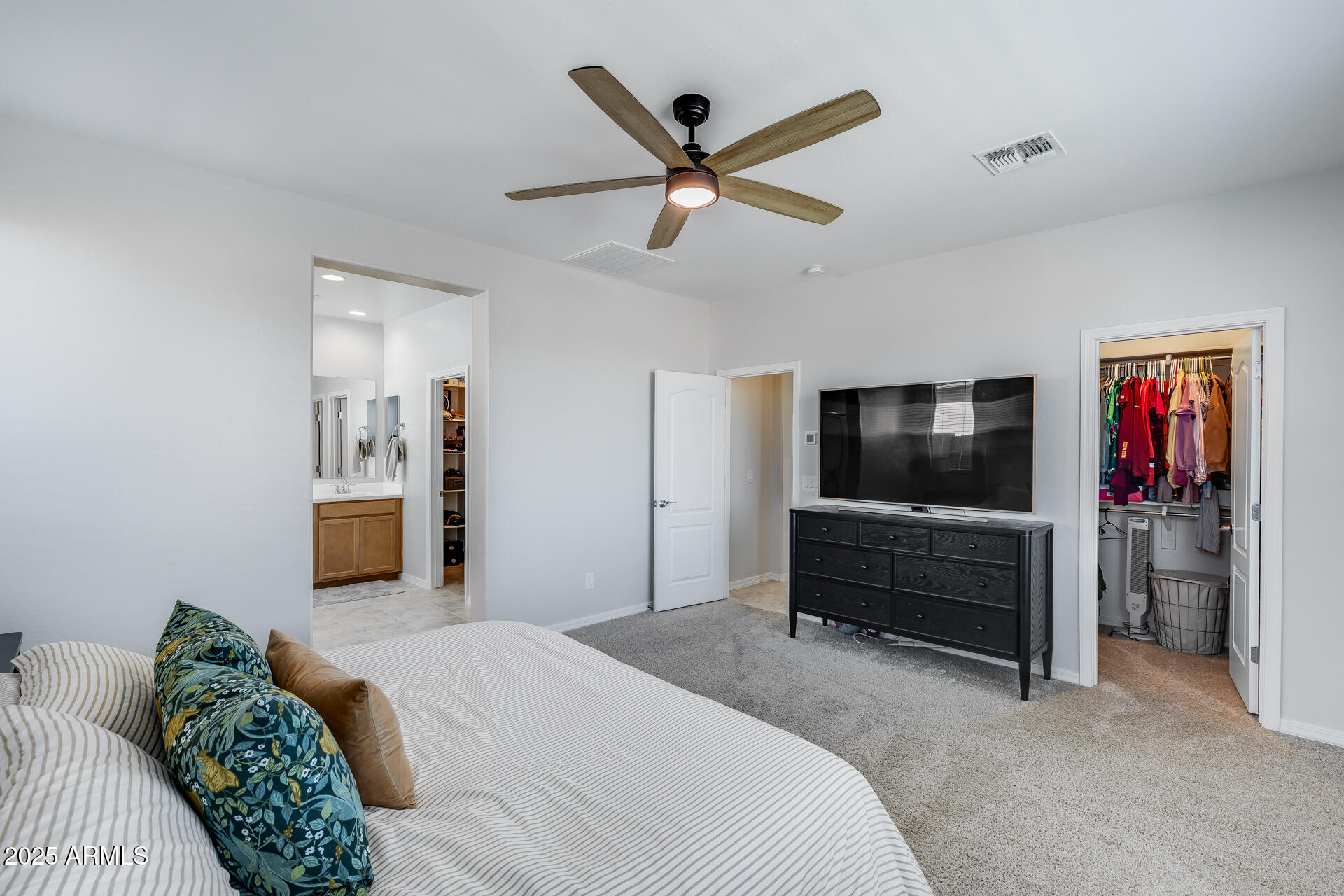 14866 West Sand Hills Road Surprise, AZ 85387 - Photo 27 of 54 a bedroom with a bed and a television