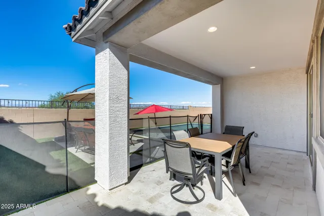 an outdoor space with furniture and umbrella