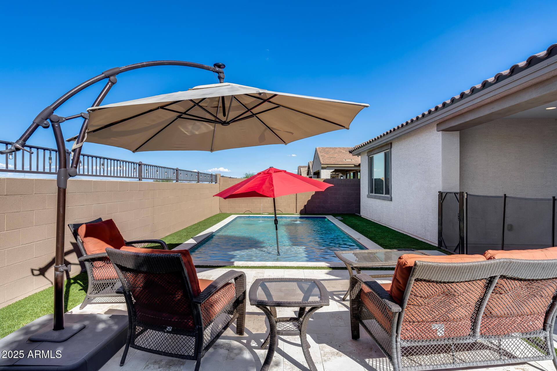 14866 West Sand Hills Road Surprise, AZ 85387 - Photo 33 of 54 an outdoor space with furniture and umbrella