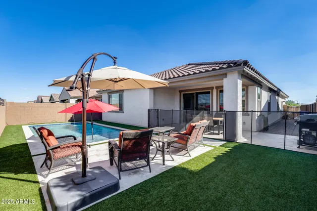 a view of a backyard with a patio