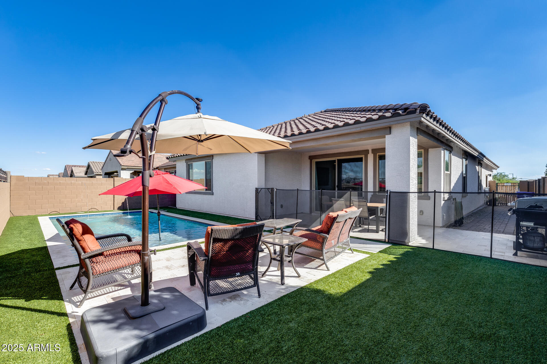 14866 West Sand Hills Road Surprise, AZ 85387 - Photo 34 of 54 a view of a house with backyard sitting area and garden