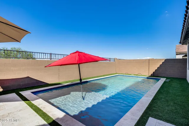 a view of a backyard with a lake view