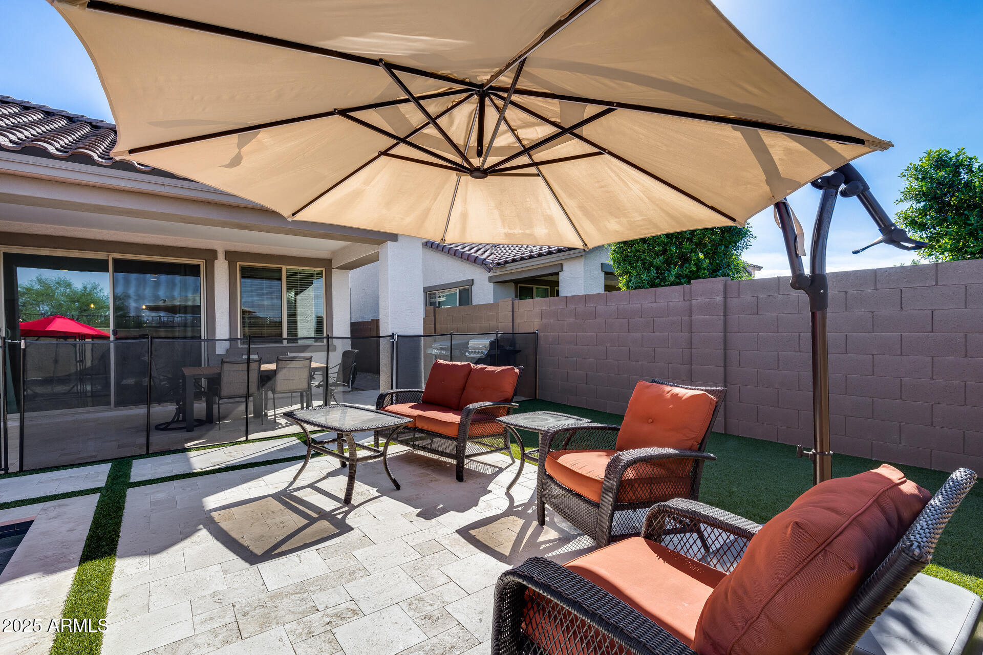 14866 West Sand Hills Road Surprise, AZ 85387 - Photo 39 of 54 a outdoor space with patio the couches and a umbrella