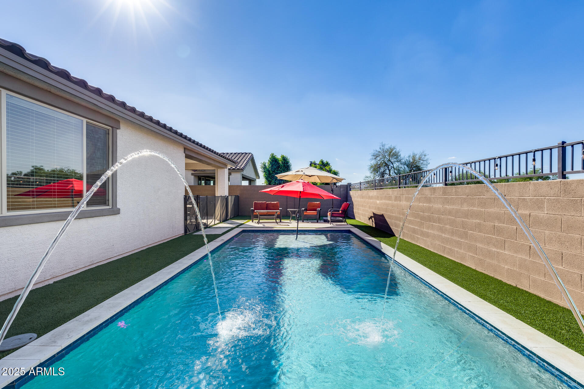 14866 West Sand Hills Road Surprise, AZ 85387 - Photo 4 of 54 a swimming pool with yard from inside the house