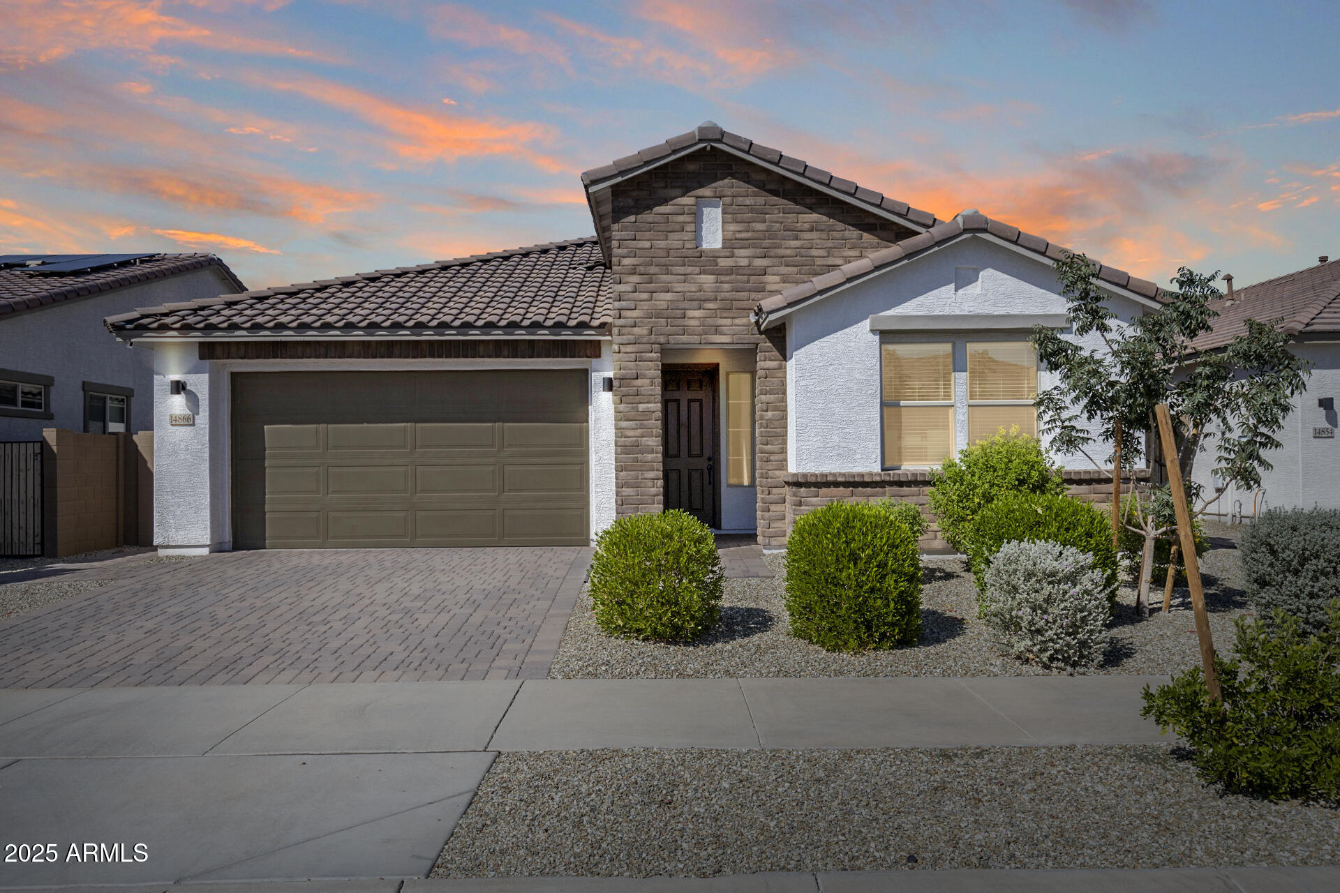 14866 West Sand Hills Road Surprise, AZ 85387 - Photo 47 of 54 a front view of a house with garden