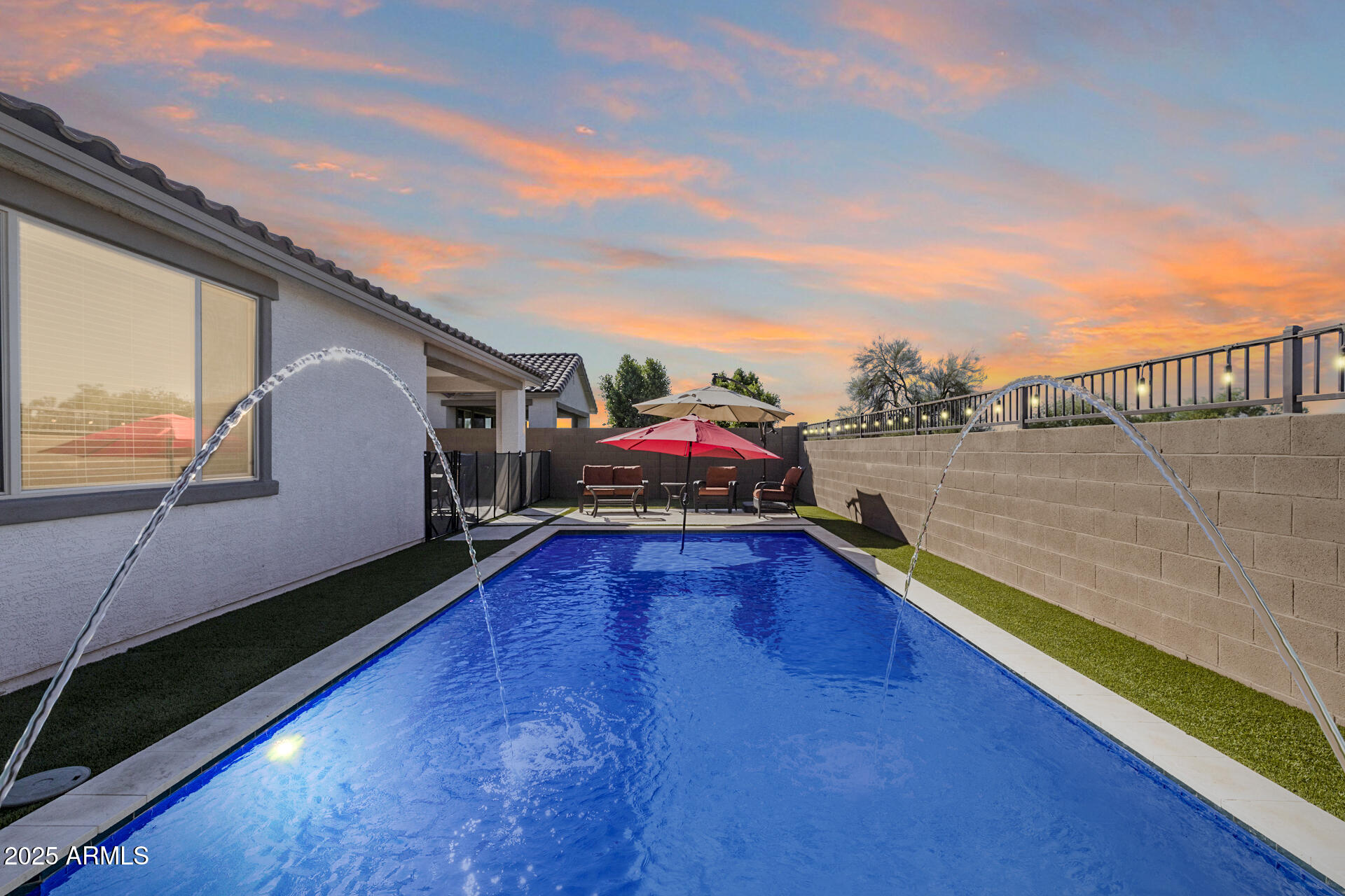 14866 West Sand Hills Road Surprise, AZ 85387 - Photo 49 of 54 a swimming pool with outdoor seating and yard