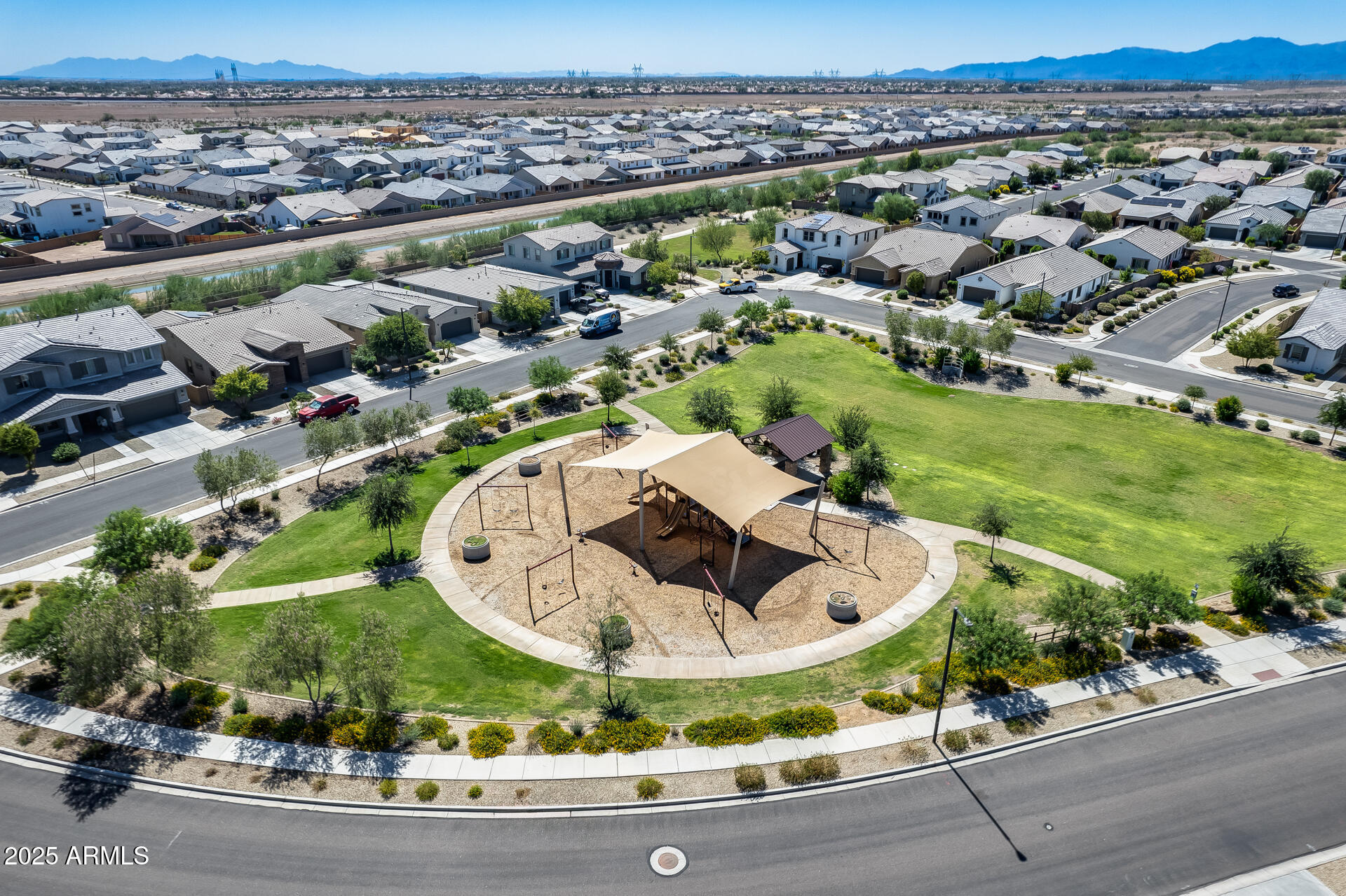 14866 West Sand Hills Road Surprise, AZ 85387 - Photo 50 of 54 an aerial view of a house with a yard and lake view