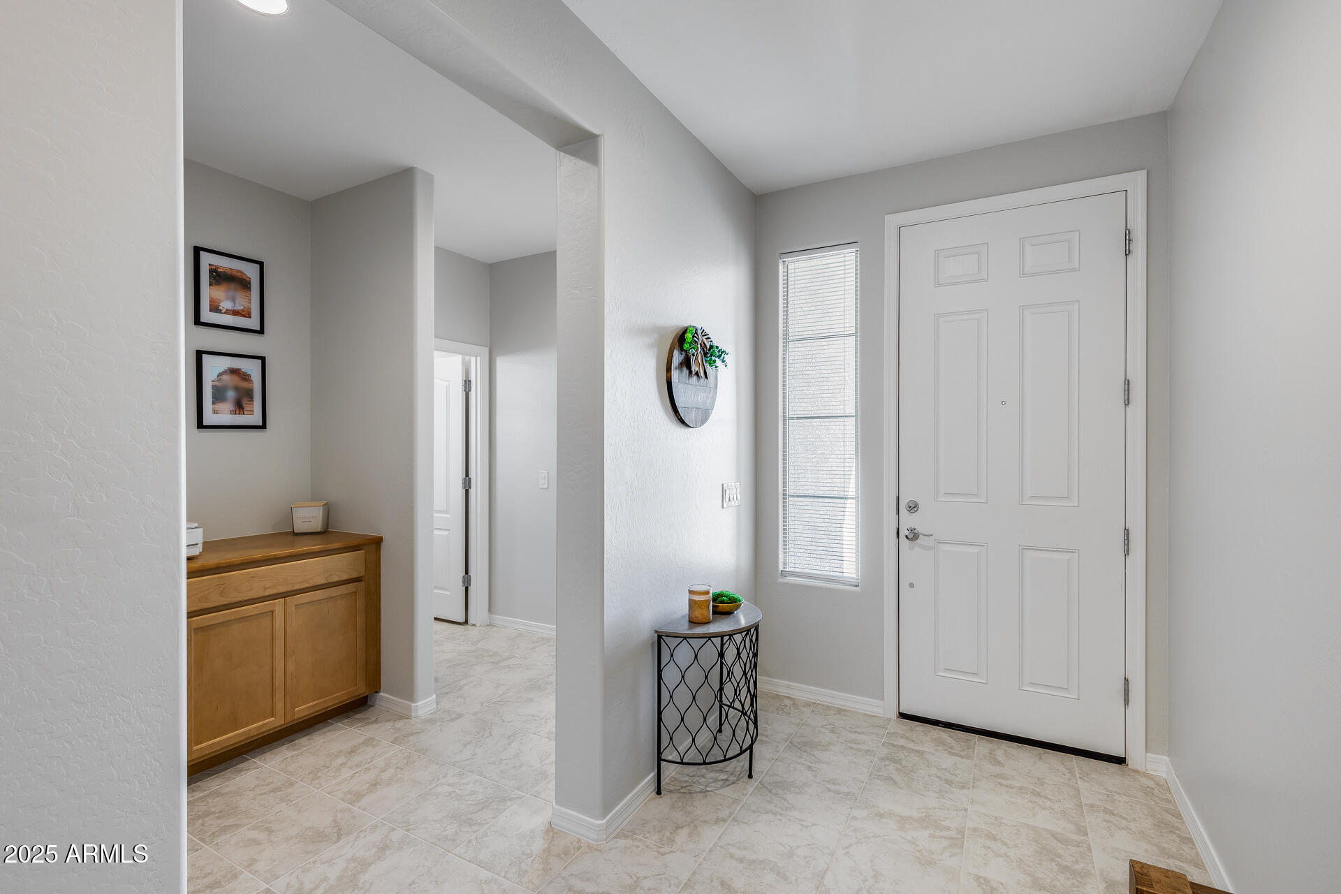14866 West Sand Hills Road Surprise, AZ 85387 - Photo 8 of 54 a view of livingroom with hardwood floor and cabinet
