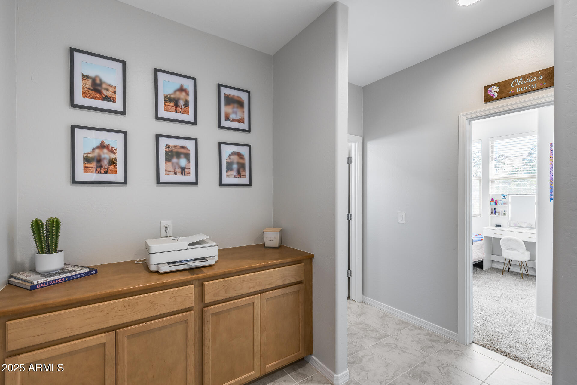 14866 West Sand Hills Road Surprise, AZ 85387 - Photo 9 of 54 a room with a painting on the wall and a potted plant