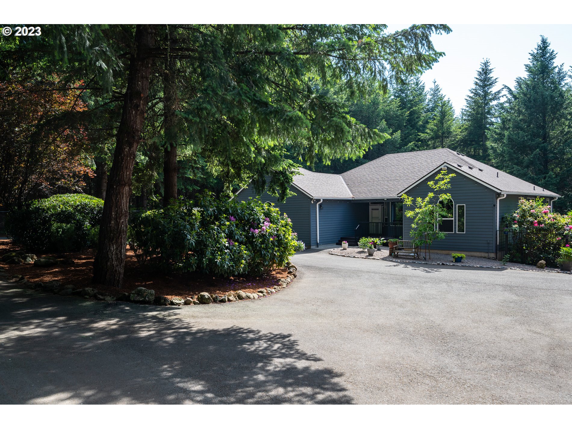 12133 Southeast Laughing Water Road Sandy, OR 97055 - Photo 1 of 47 a view of a house with yard and a tree