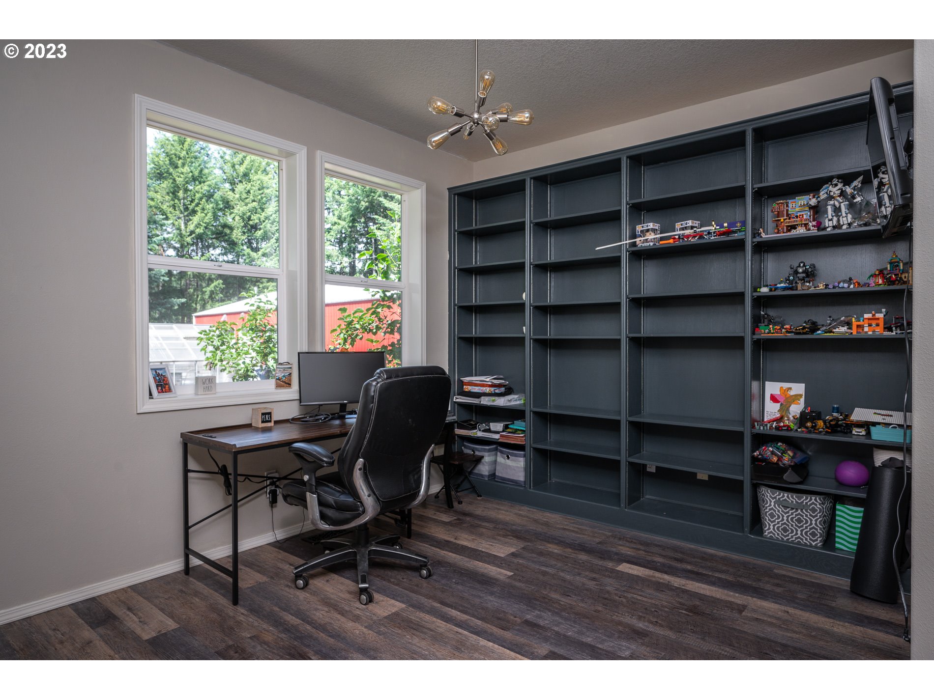 12133 Southeast Laughing Water Road Sandy, OR 97055 - Photo 19 of 47 a view of a workspace with furniture and a window