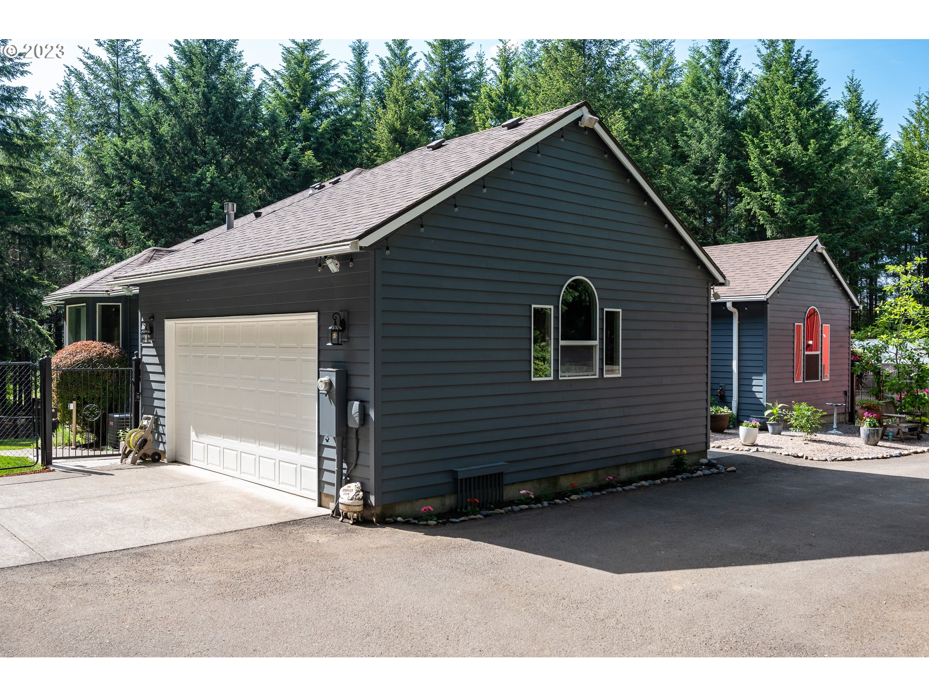 12133 Southeast Laughing Water Road Sandy, OR 97055 - Photo 3 of 47 a view of a house and outdoor space