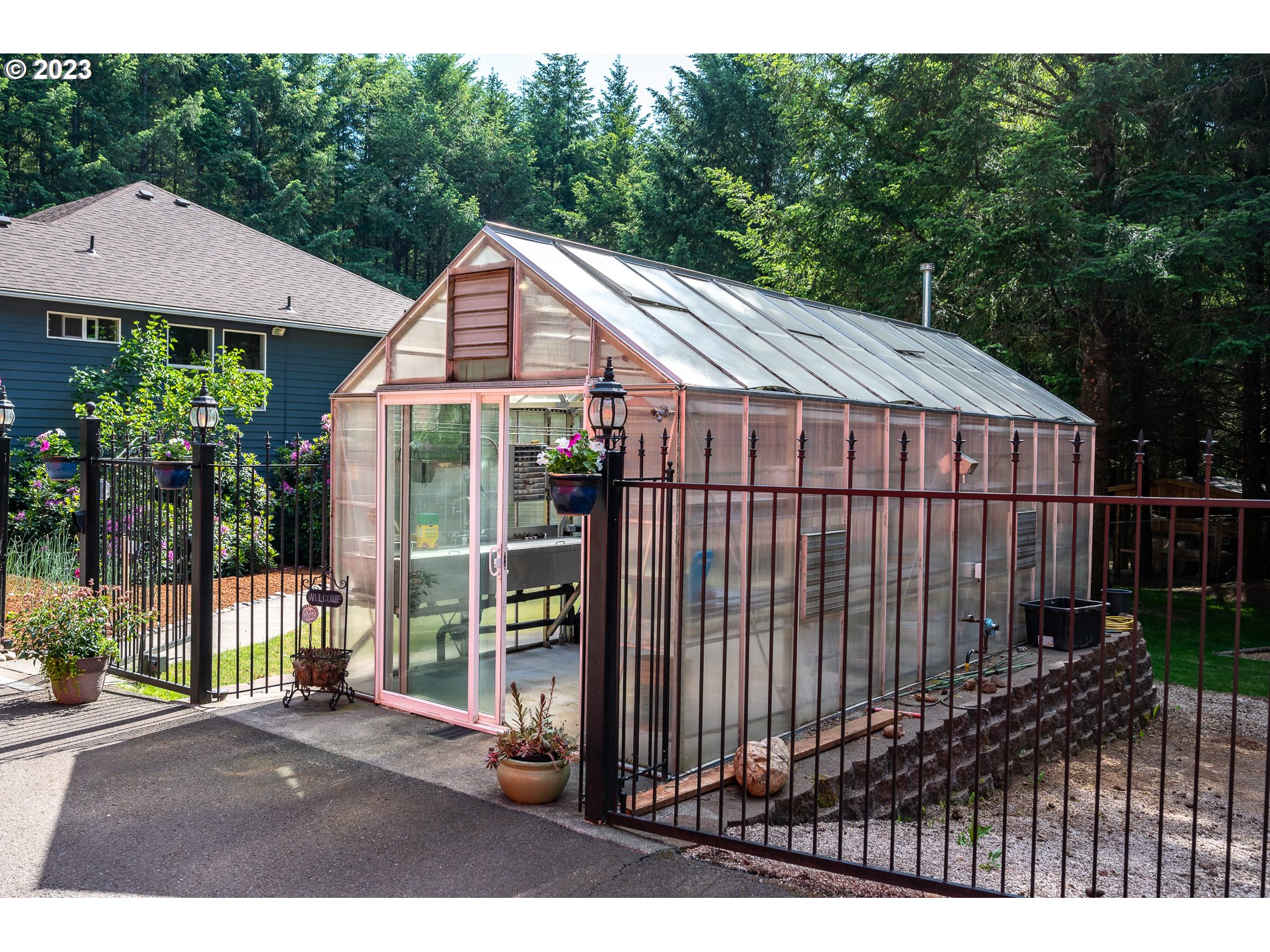 12133 Southeast Laughing Water Road Sandy, OR 97055 - Photo 45 of 47 a house view with a garden