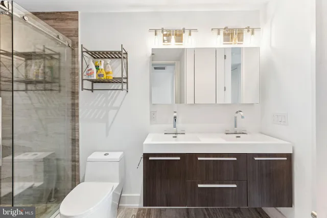 a view of room with furniture and wooden floor