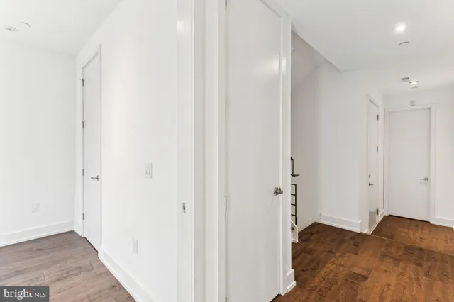 a roof deck with table and chairs