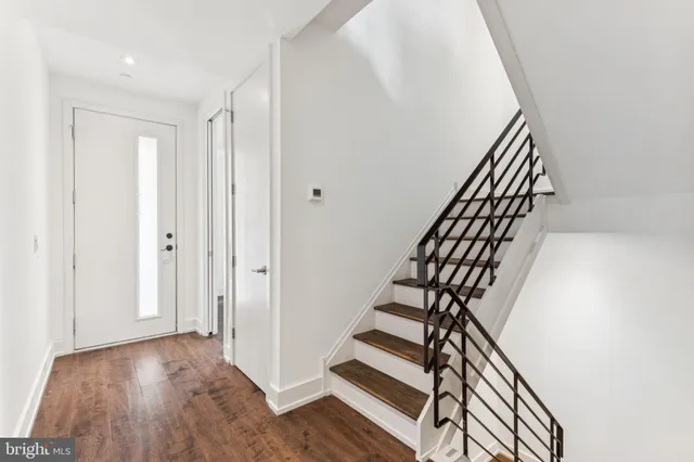 a view of a chairs and table in a balcony