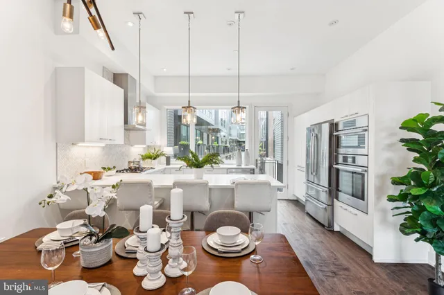 a kitchen with a sink a window and cabinets