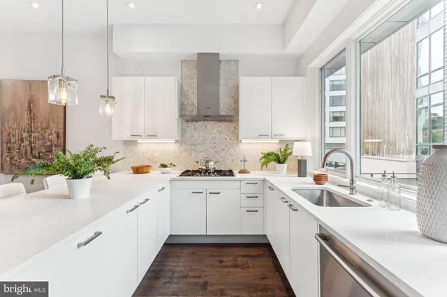a kitchen with a refrigerator and a sink
