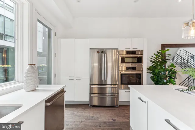 a view of a brick house with a large window