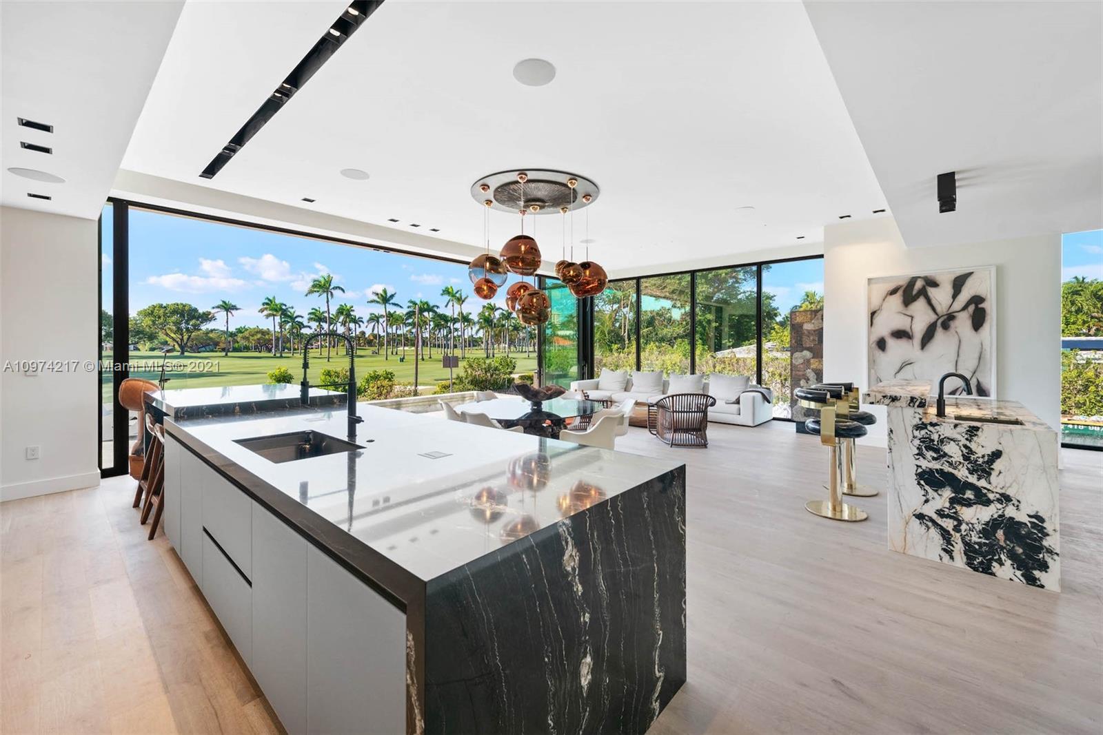 5470 La Gorce Drive Miami Beach, FL 33140 - Photo 11 of 71 a kitchen with a sink and living room view