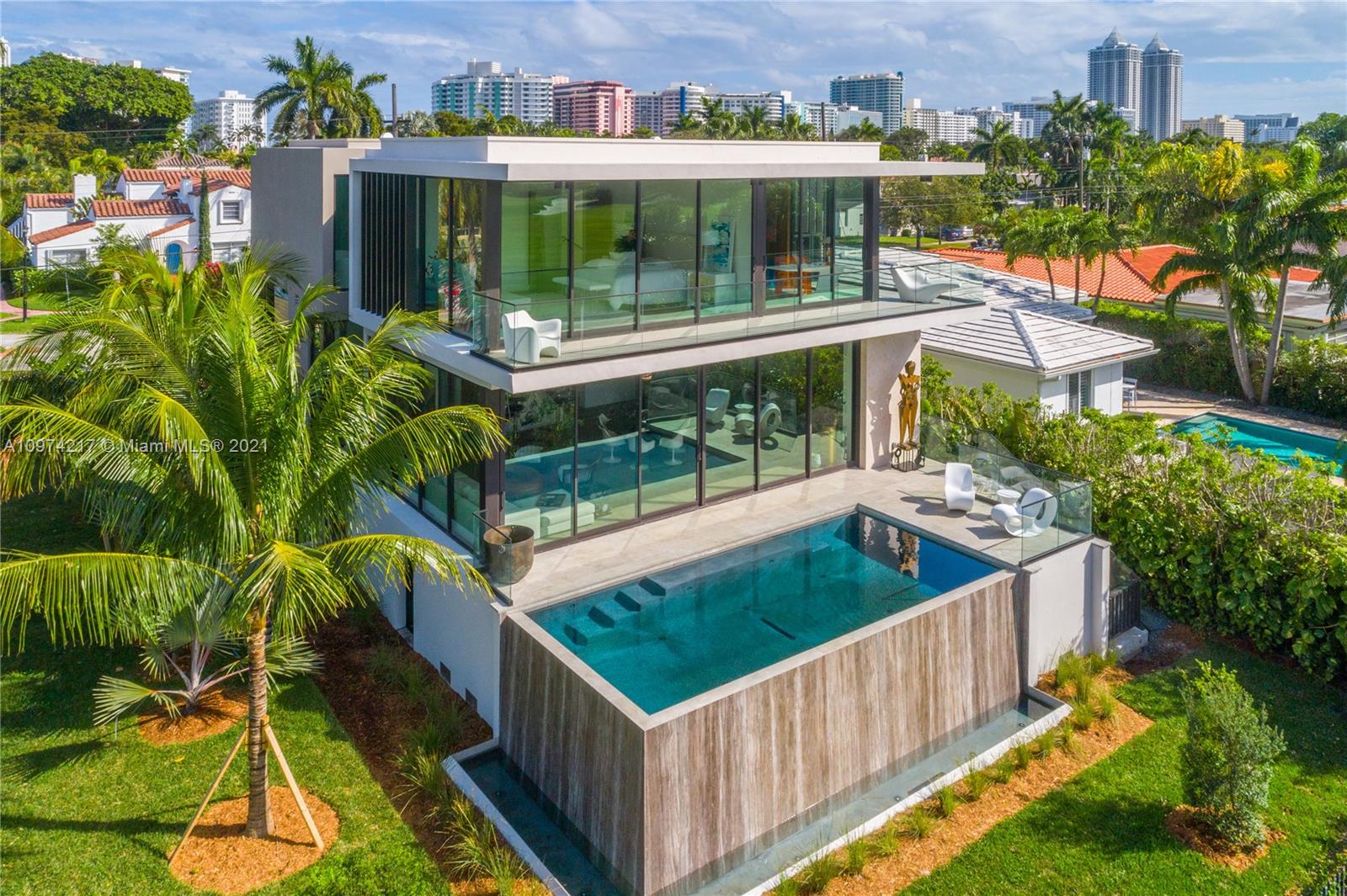 5470 La Gorce Drive Miami Beach, FL 33140 - Photo 2 of 71 an outdoor view of a house having outdoor seating
