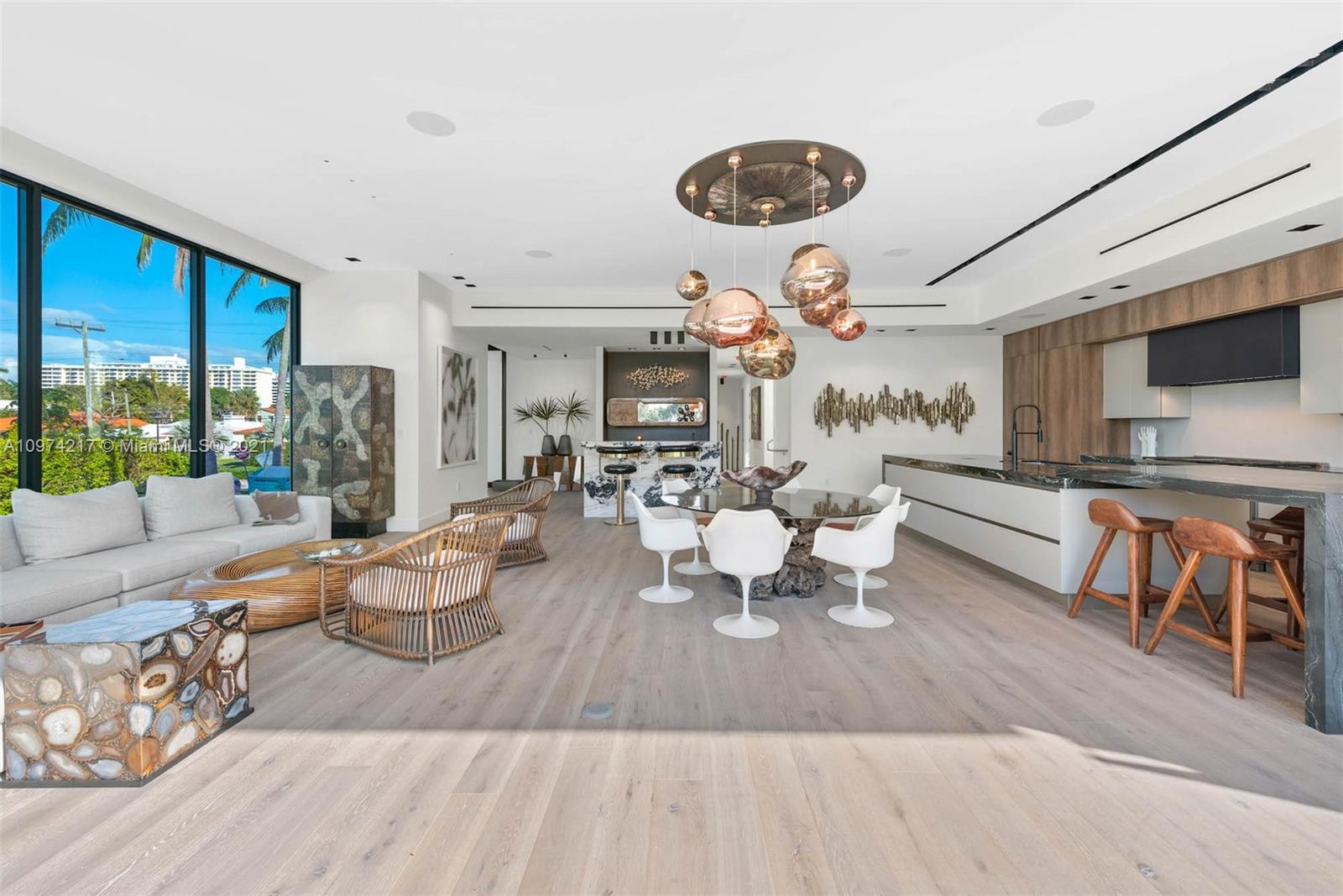 5470 La Gorce Drive Miami Beach, FL 33140 - Photo 22 of 71 a living room with fireplace furniture and a large window