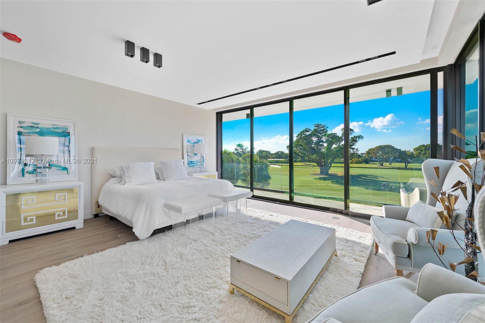 5470 La Gorce Drive Miami Beach, FL 33140 - Photo 26 of 71 a spacious bedroom with a bed and a view of bedroom