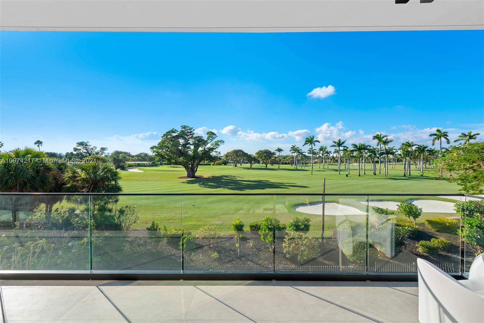 5470 La Gorce Drive Miami Beach, FL 33140 - Photo 36 of 71 a view of a golf course with a lake