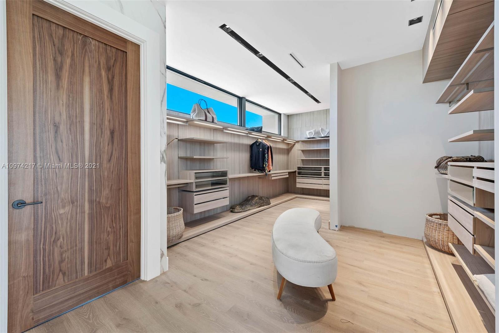 5470 La Gorce Drive Miami Beach, FL 33140 - Photo 39 of 71 a living room with furniture and a flat screen tv