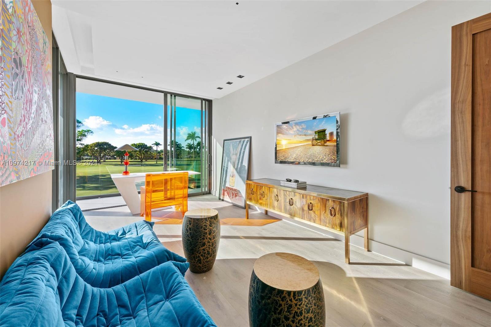 5470 La Gorce Drive Miami Beach, FL 33140 - Photo 48 of 71 a living room with furniture a rug and a flat screen tv
